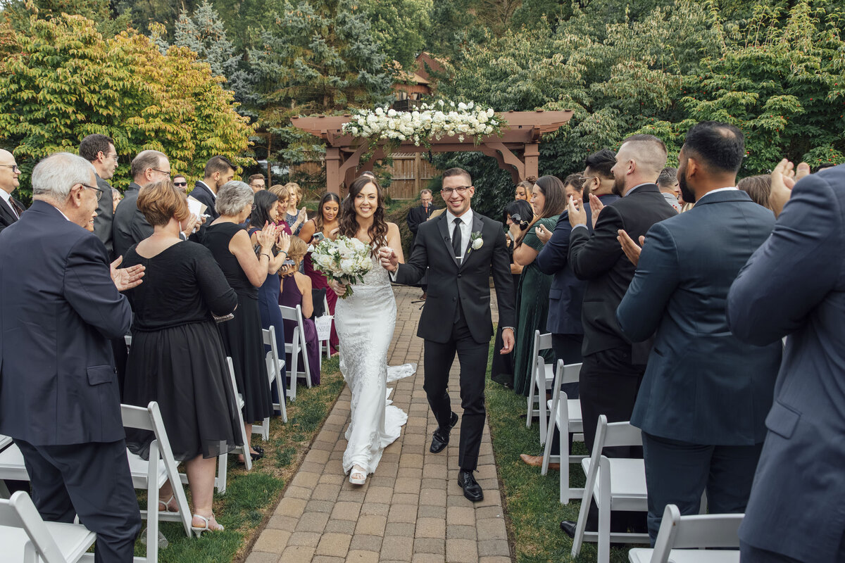 Minerals Hotel | Bride and groom walking down aisle during summer wedding ceremony | Vernon Township, New Jersey