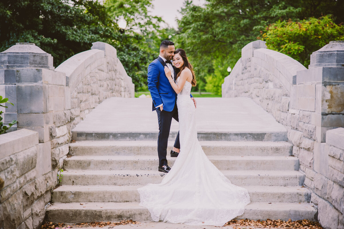 indian christian bride and groom on the wedding day on the steps at verona park nj