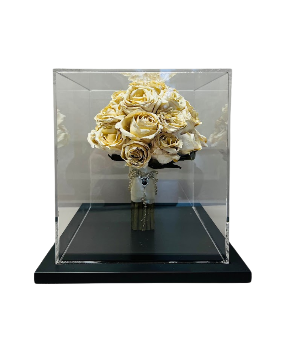 Wedding bouquet preserved inside perspex keepsake.
