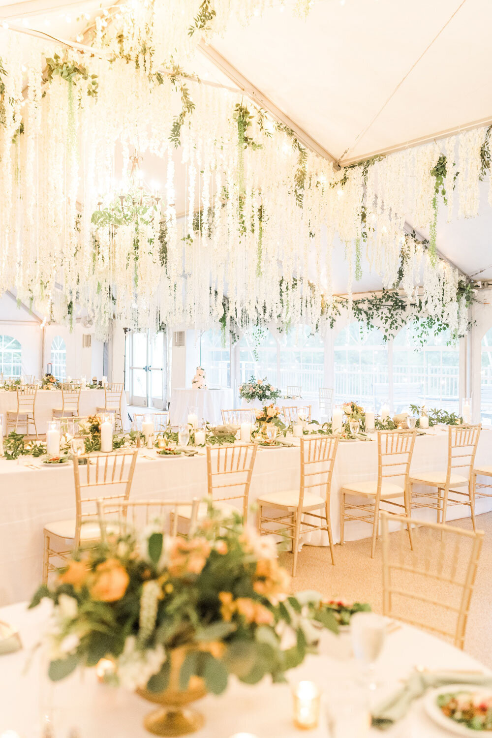 Elegant wedding reception with florals and gold chairs