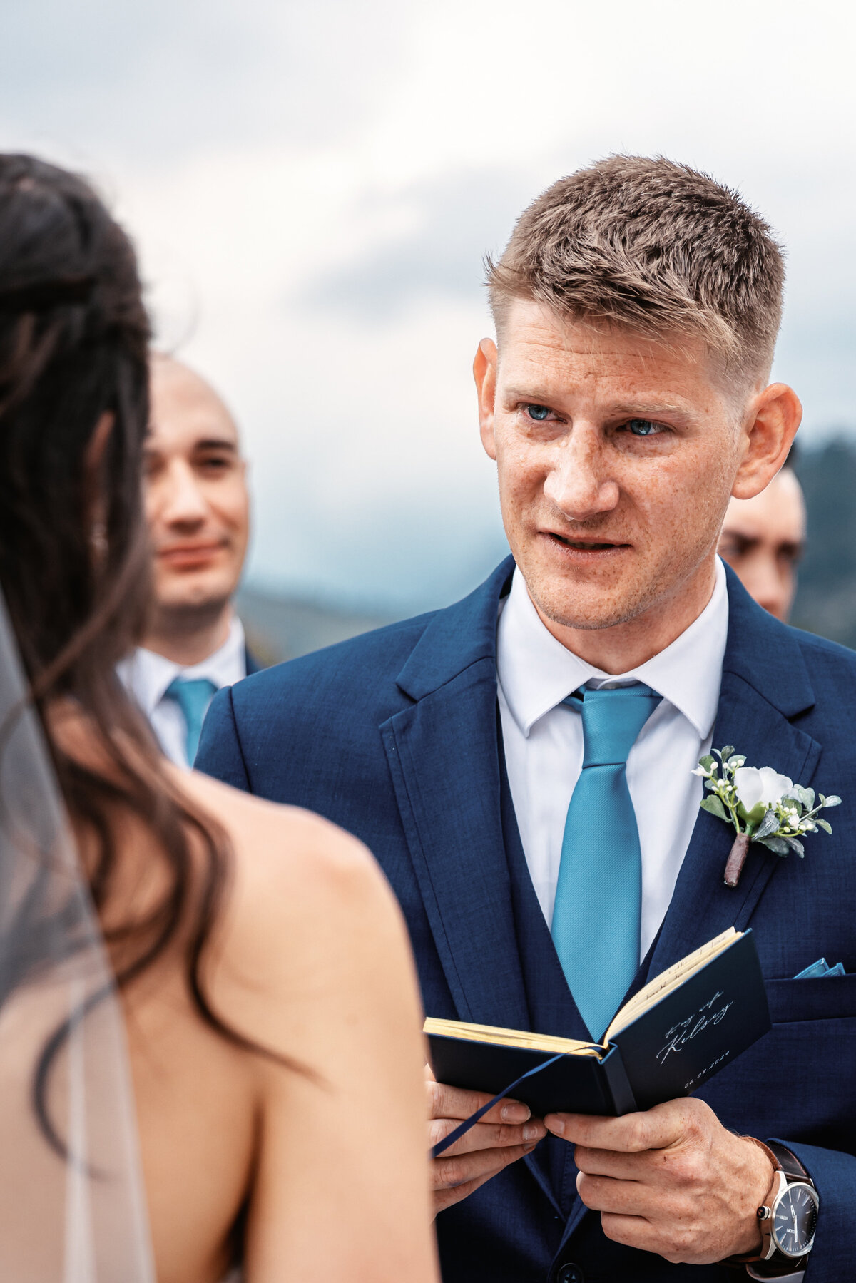 Shannon Lee, from Love Like Wild Photography, captures a groom reading his vows to his bride during their wedding ceremony.