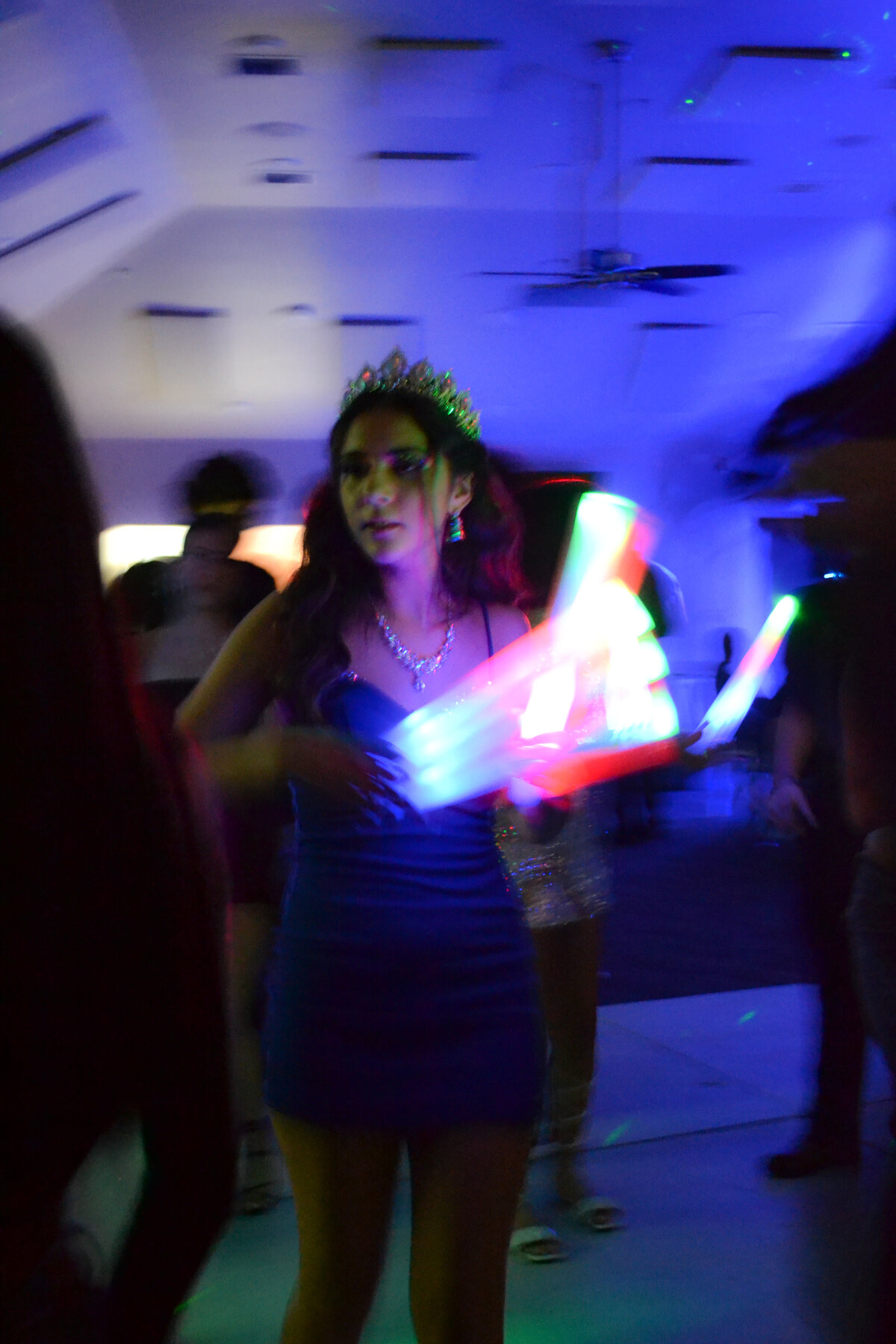 dance floor candid photo, light wand, movement