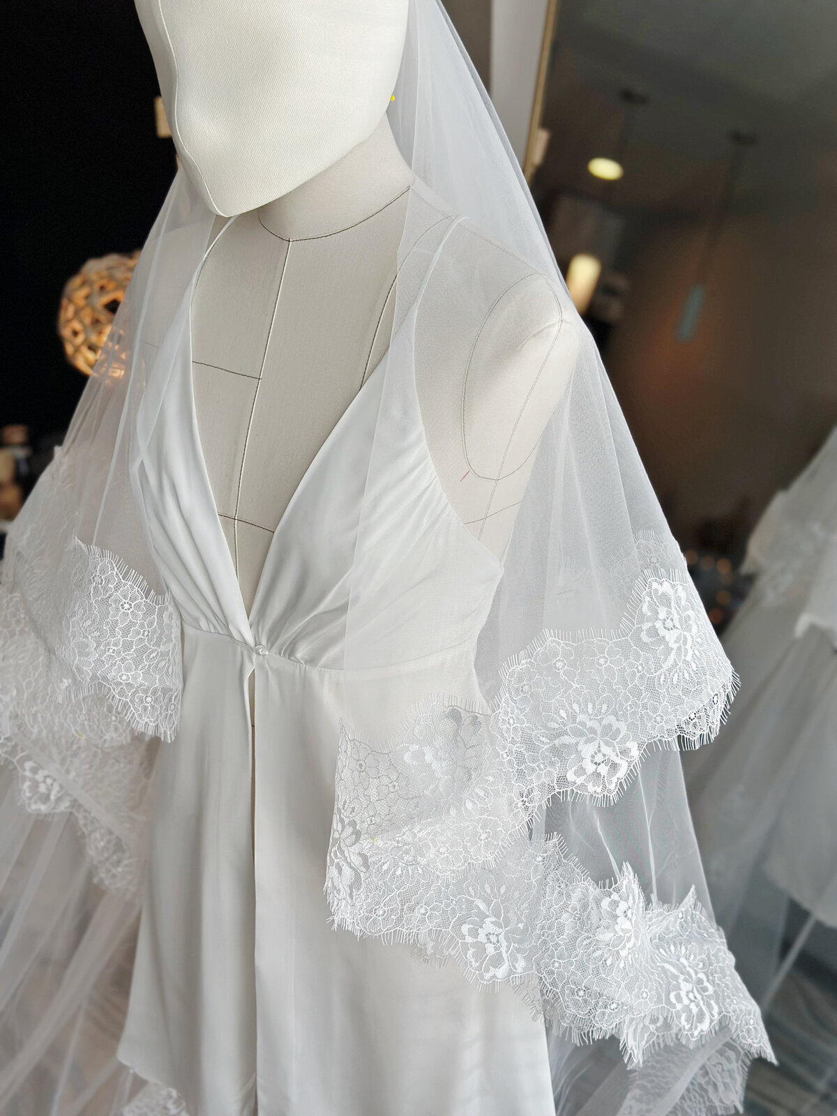 Bride styled with handmade blusher veil and lace trim
