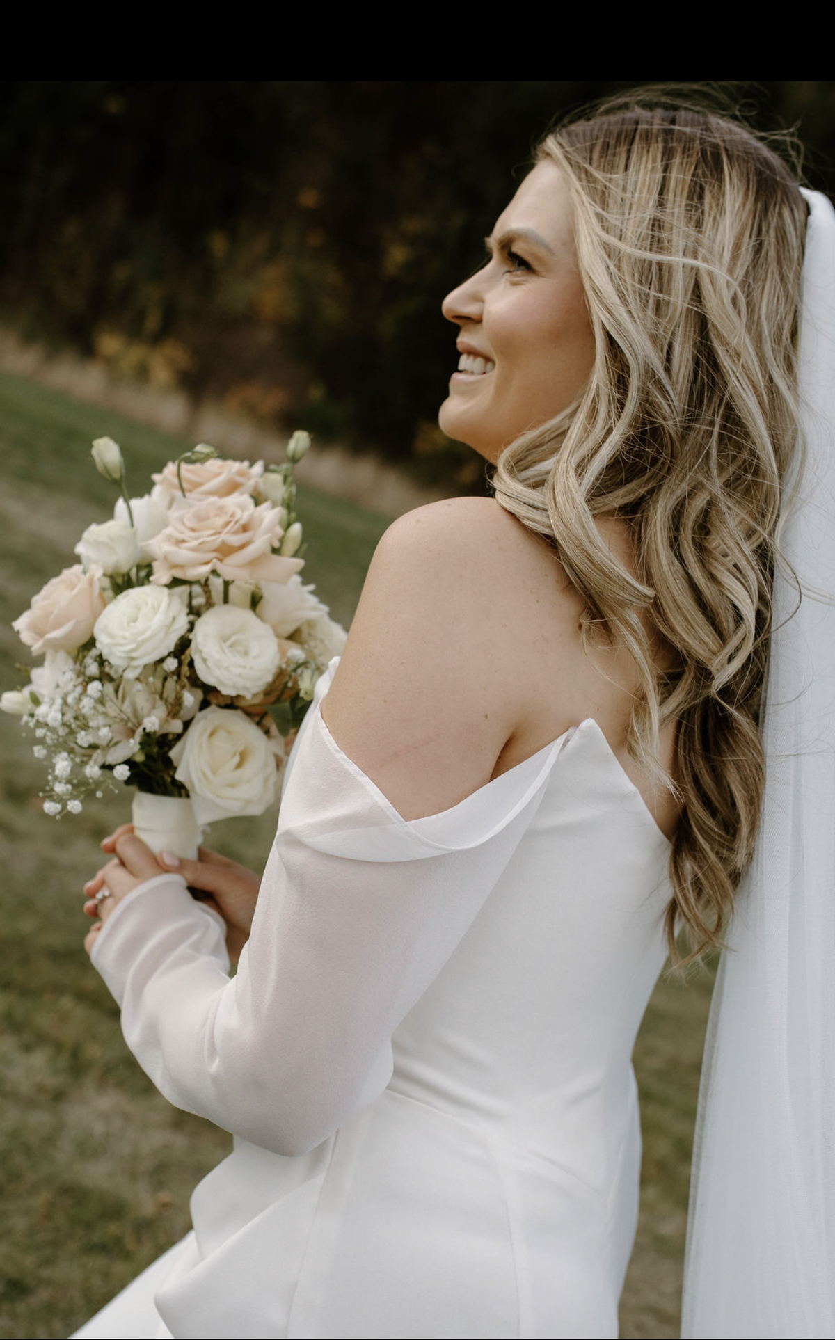 bride on wedding day in queenstown smiling