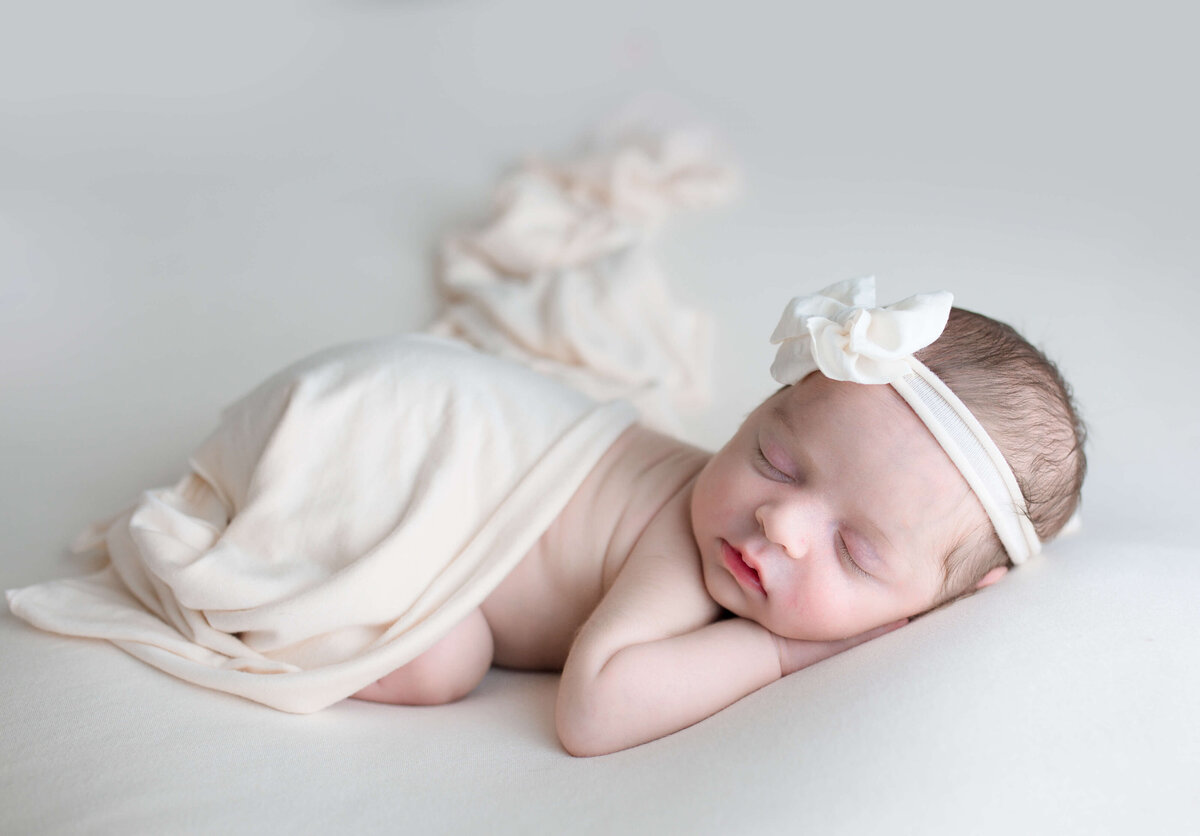 Precious newborn girl  with headband on