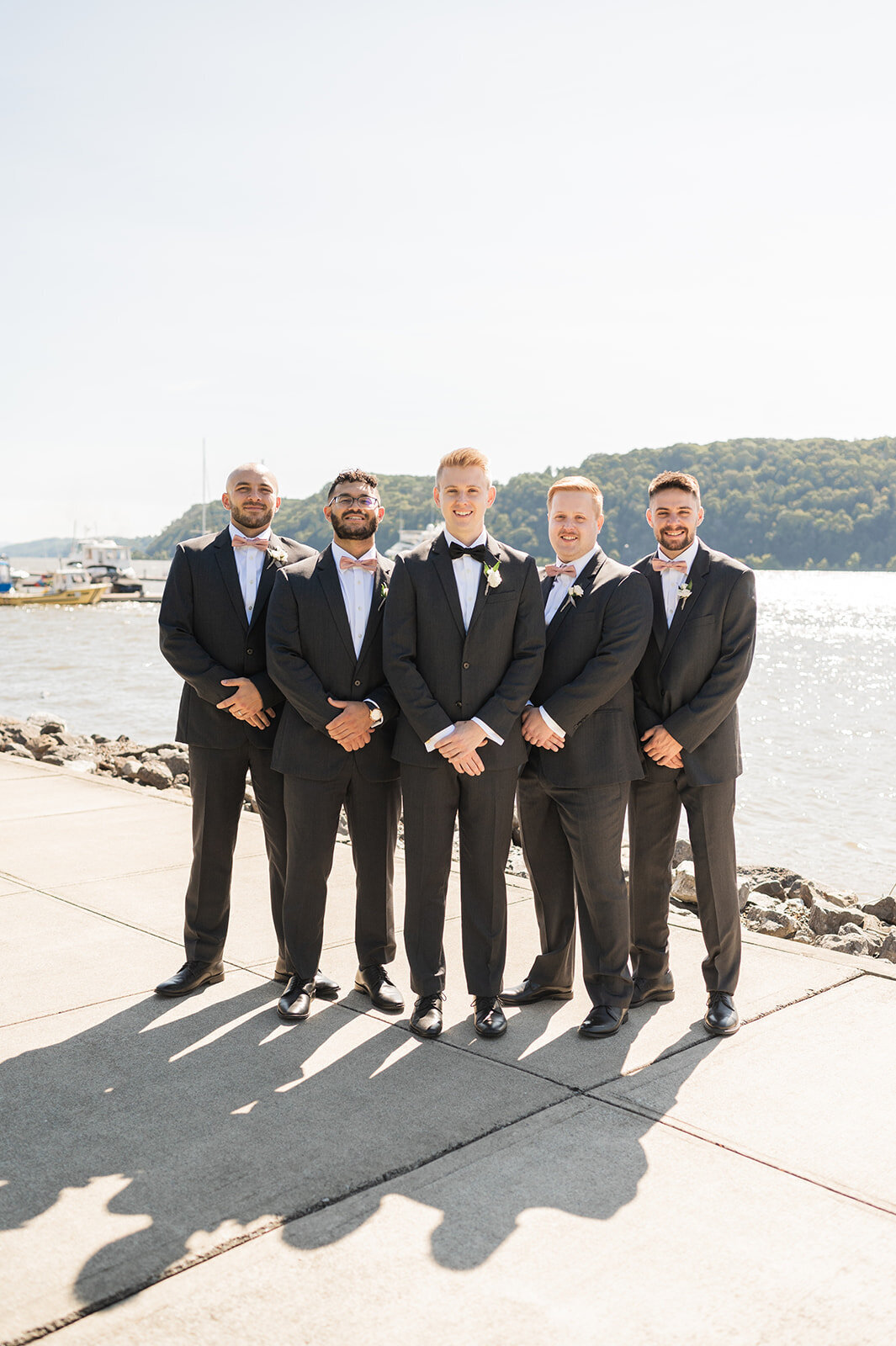 groom poses with groomsmen