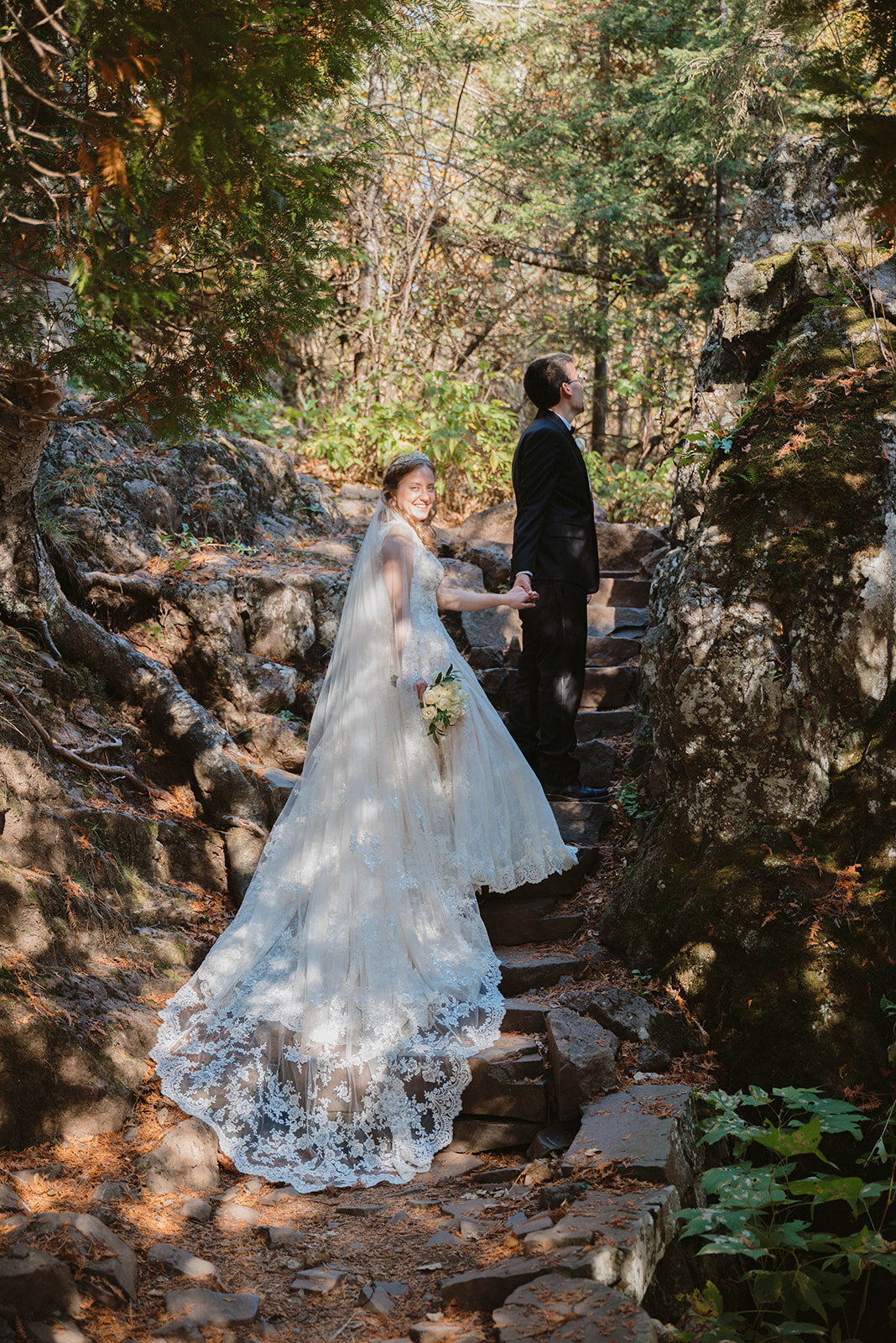 couple stand on the stairs