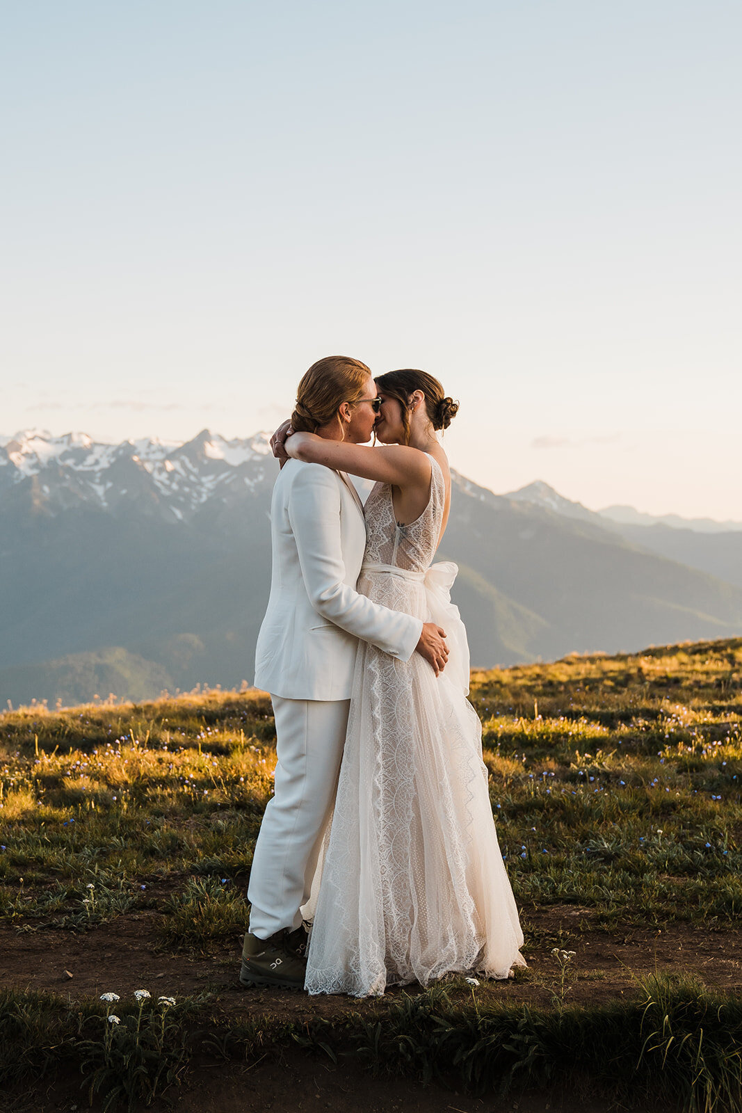 Two brides kissing on top of Hurricane Ridge during their Olympic National Park elopement!