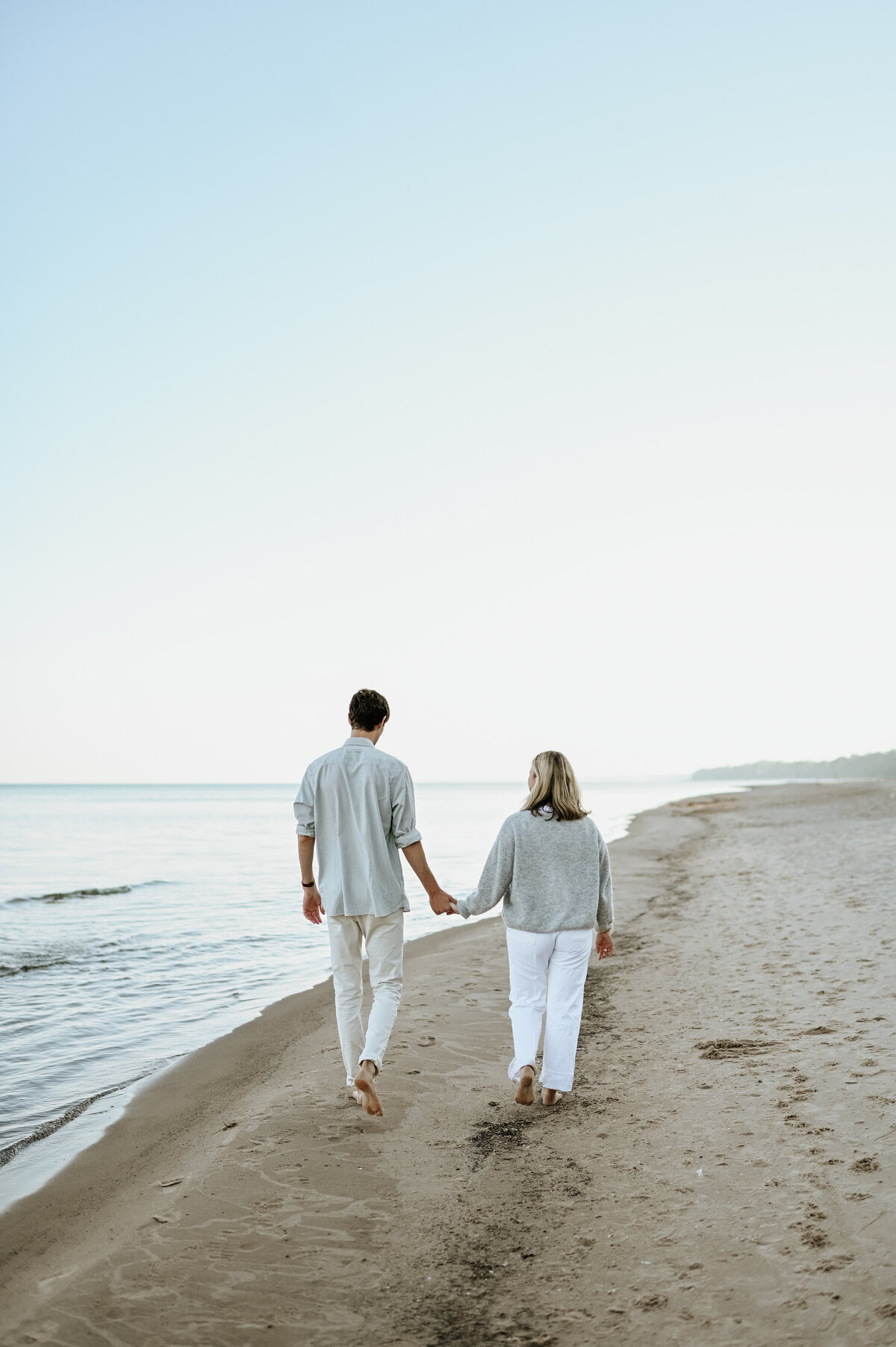 Engagement session walking on South Bend beach
