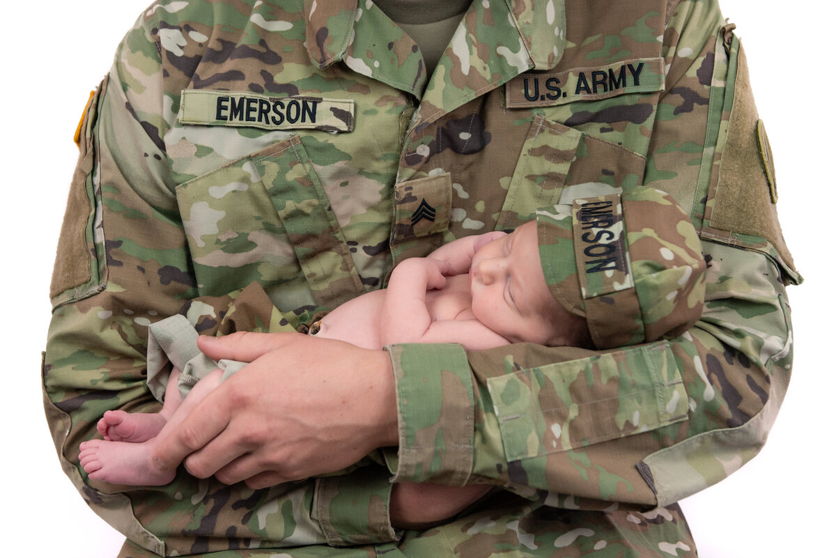 Military dad holding newborn baby son in Kennbunk Maine