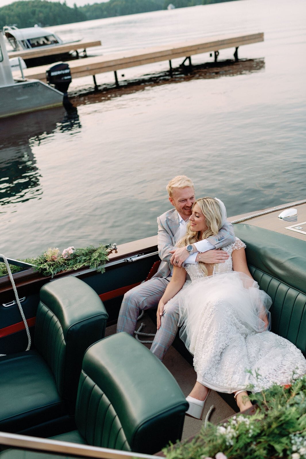 Bride and Groom Editorial Portrait on Luxury Wooden Boat Muskoka Lakes Golf and Country Resort Wedding Jacqueline James Photography