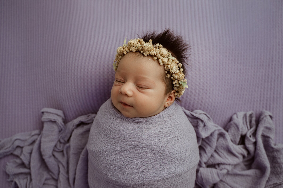 Dothan AL Newborn Photo session in studio; lavender color theme with floral crown and baby girl with hair