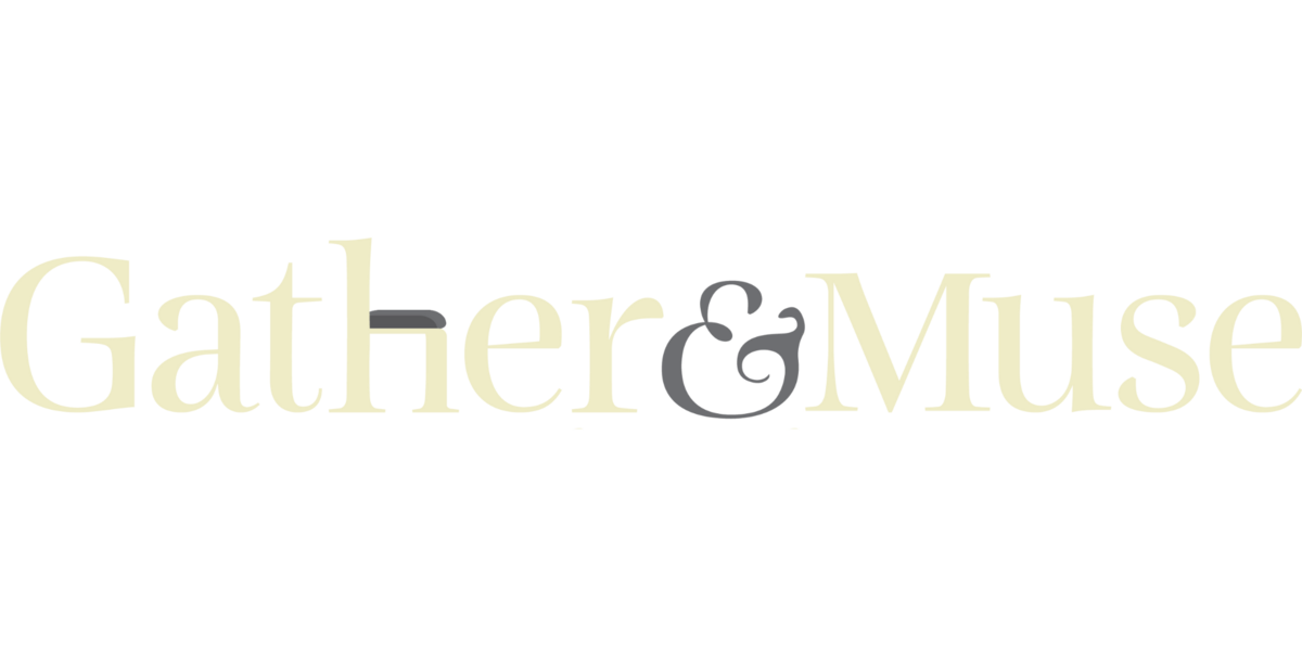 The primary logo for Gather and Muse, in a golden yellow. The h is a chair.