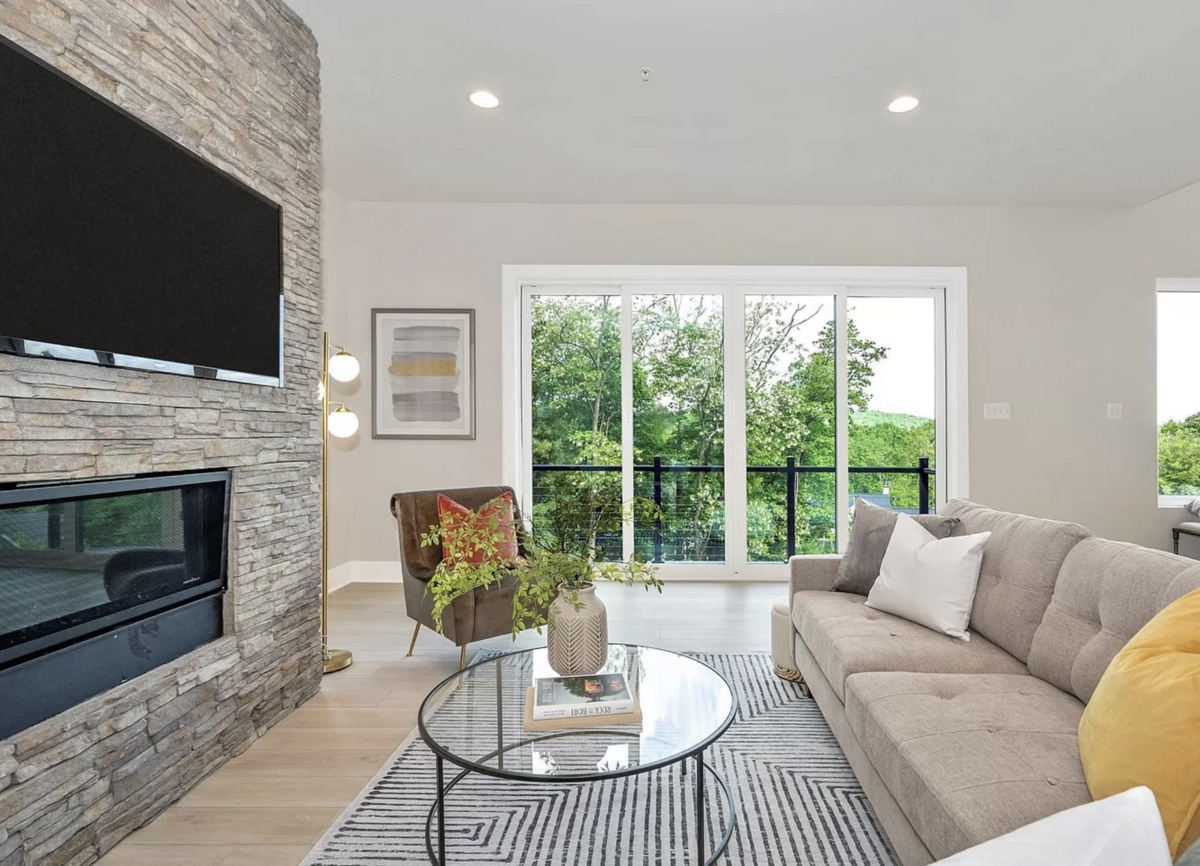 Living room with fireplace and large windows