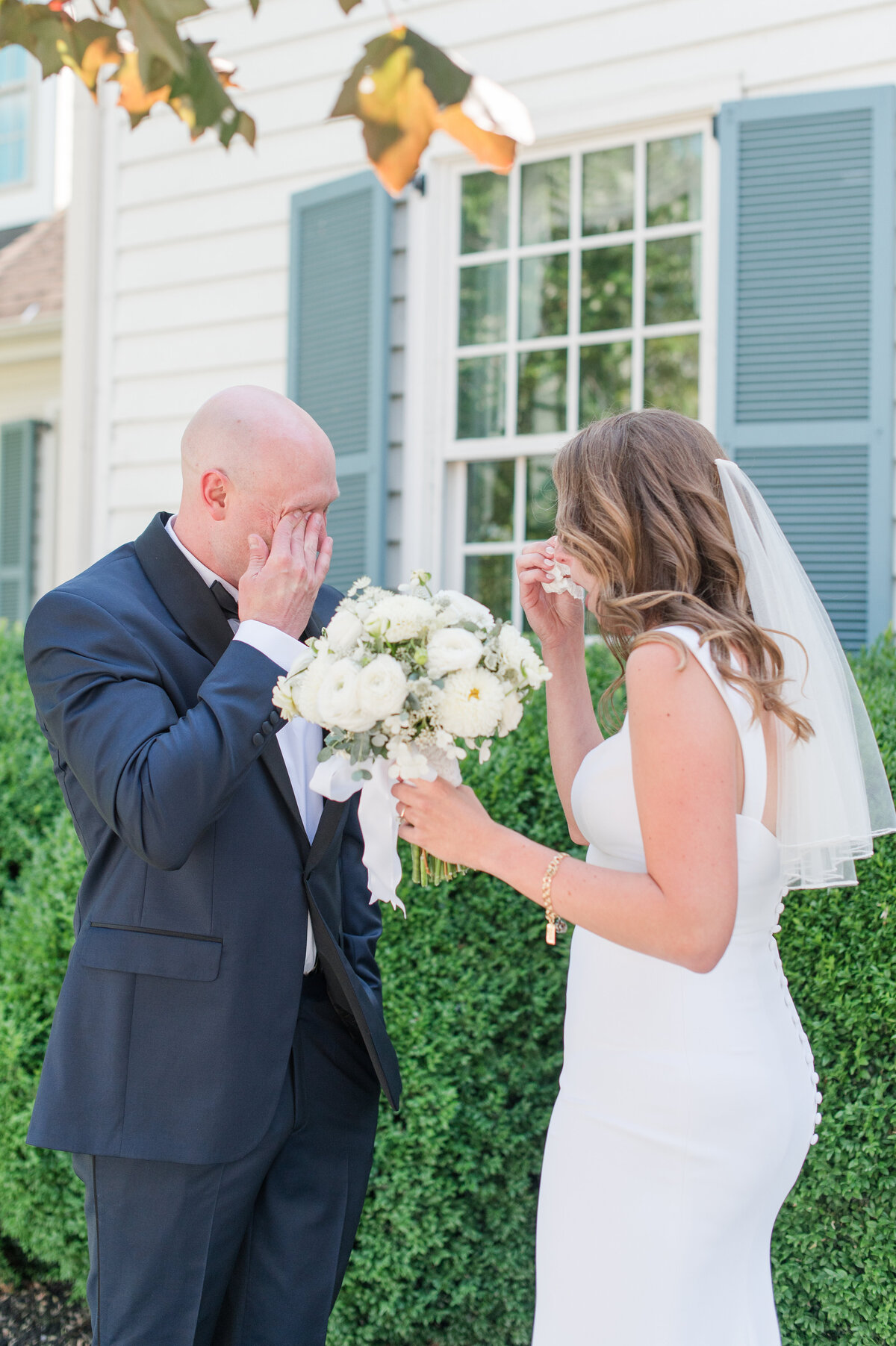 couple crying during a wedding first look