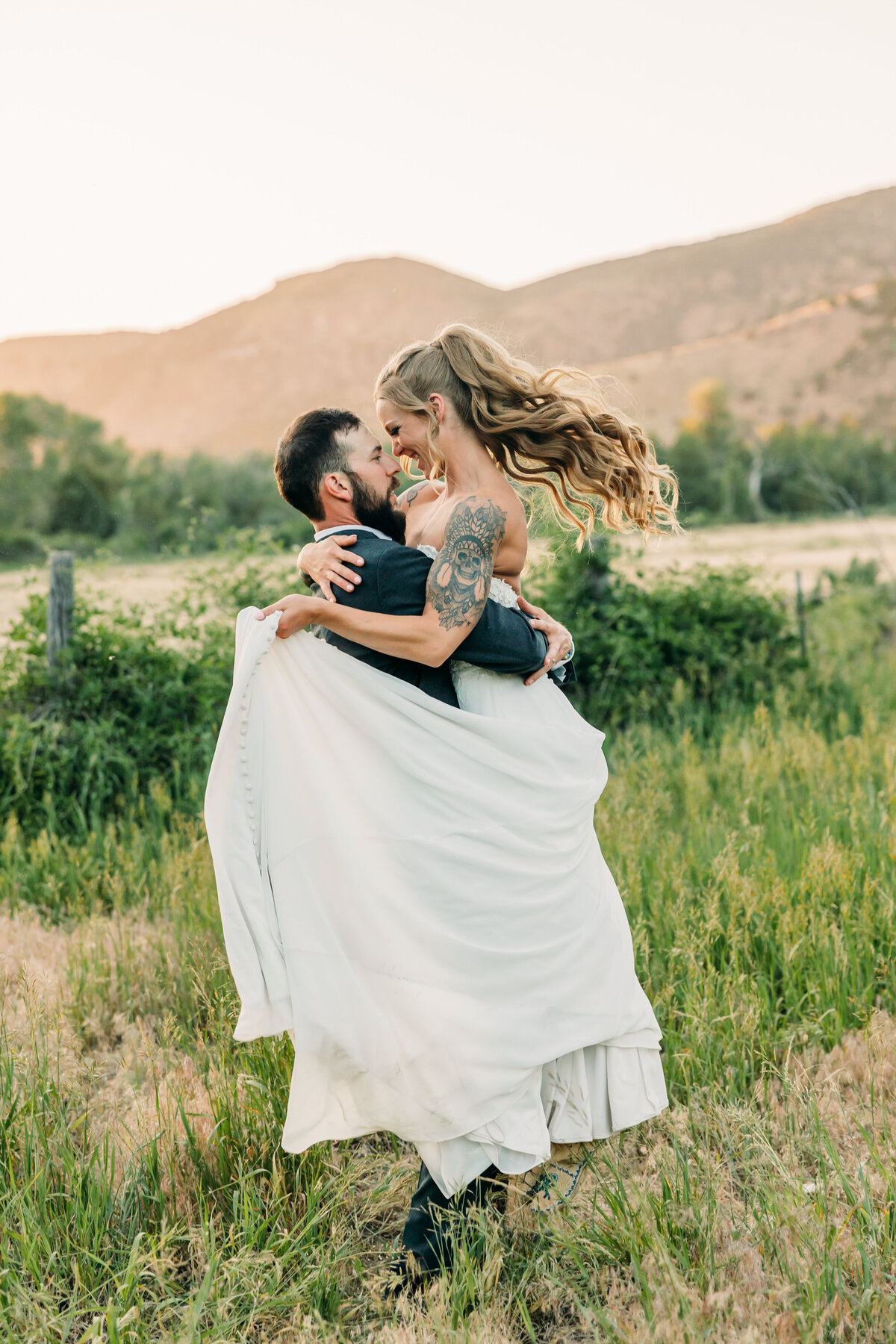 Jackson Hole couple session in front of sunset mountains
