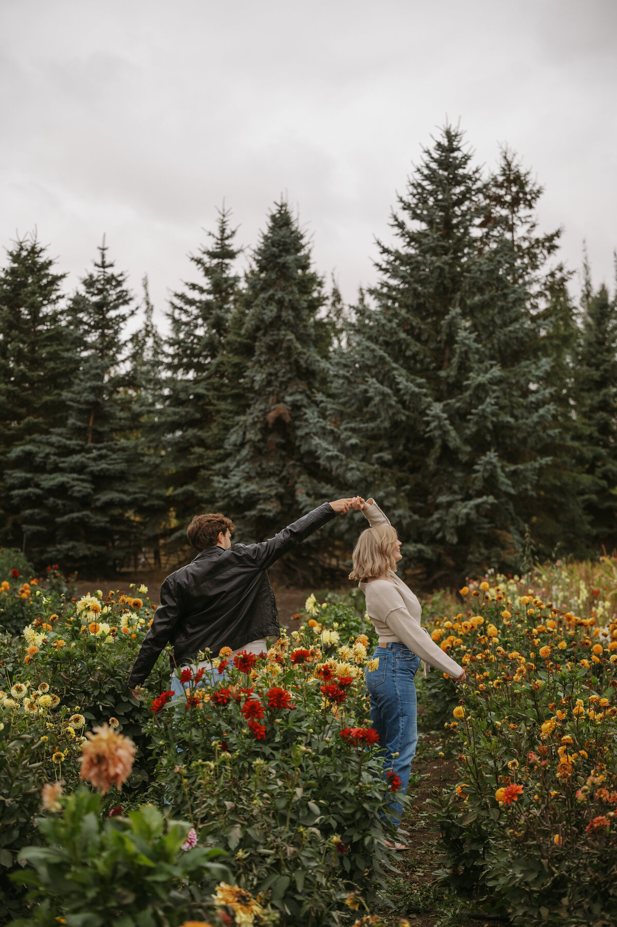 Couple dancing in a colourful field of flowers in Edmonton
