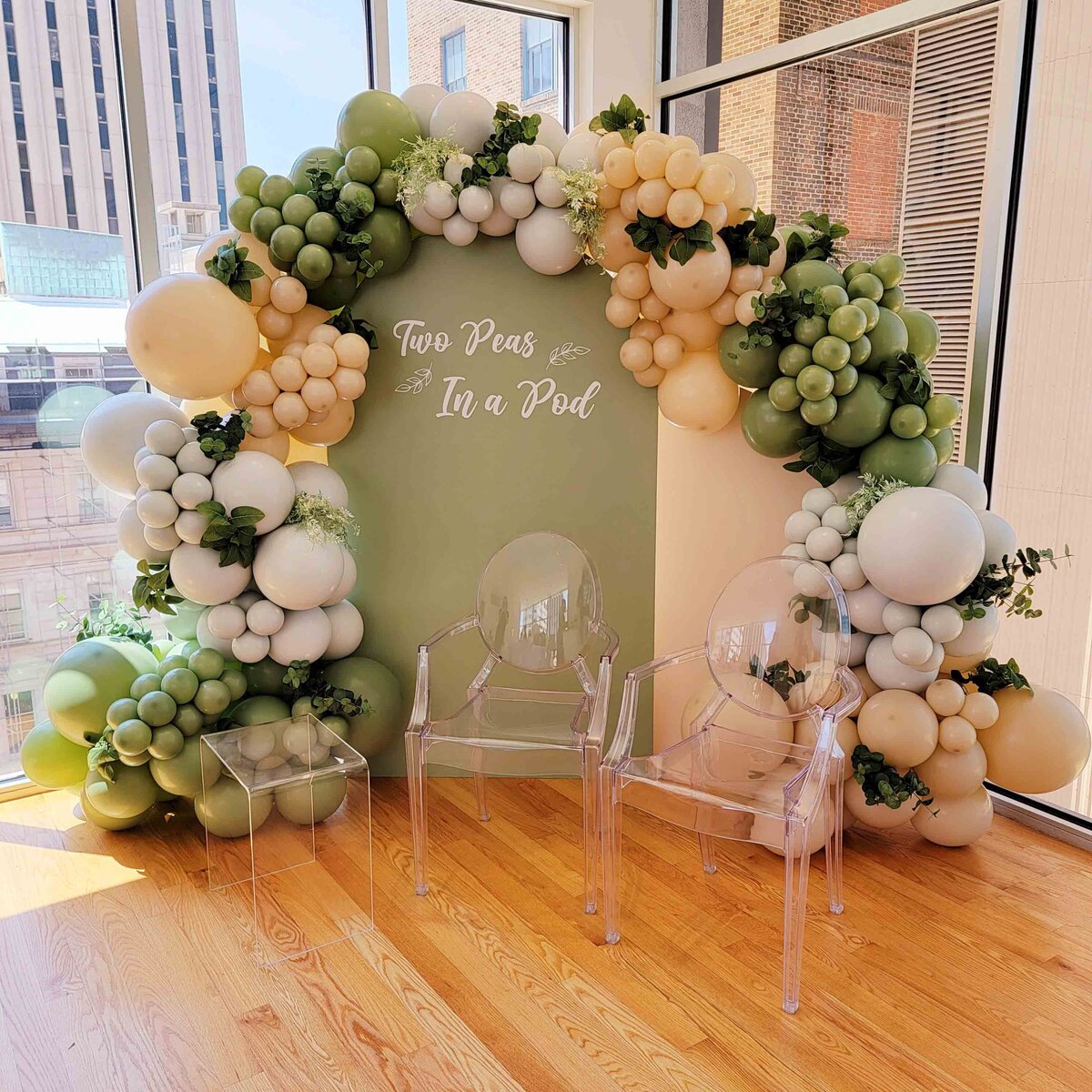 The celebration with Air with Flair Decor's Custom Balloon Installation, featuring the elegance of Fancy Green Branches.
