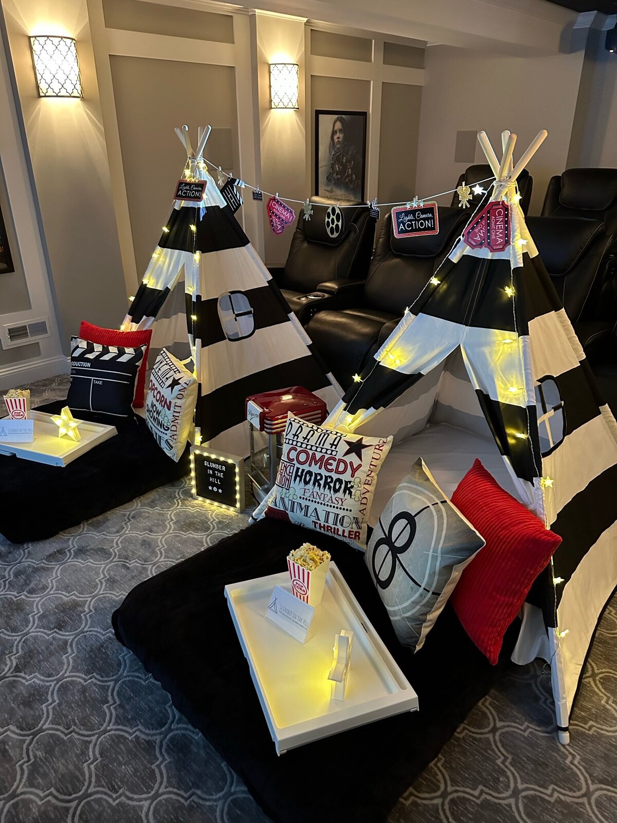 two teepee beds with movie theater decor