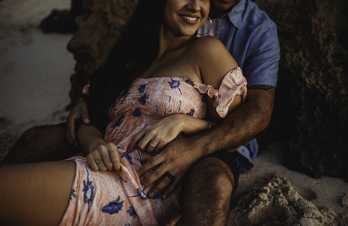 Couple cuddling on a beach