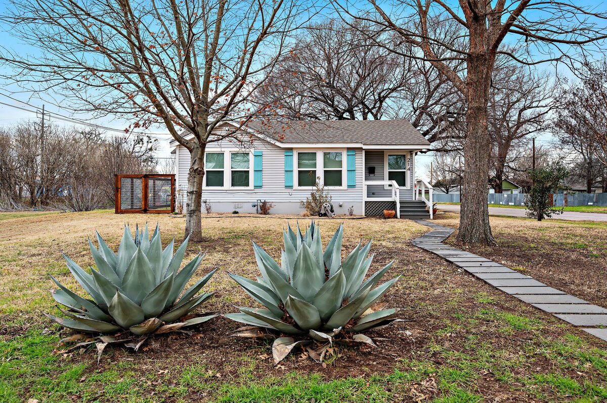 Front view of this three-bedroom, two-bathroom vacation rental house with free Wifi, fully equipped kitchen, office space, and room for six in downtown Waco, TX.
