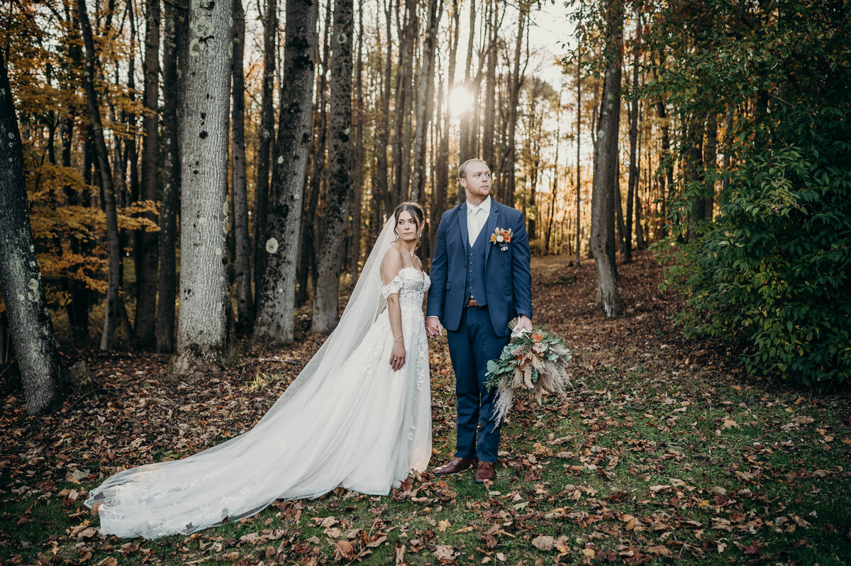 Bride and groom in a quiet moment alone, holding hands in a scenic location | Pittsburgh Wedding Photographer