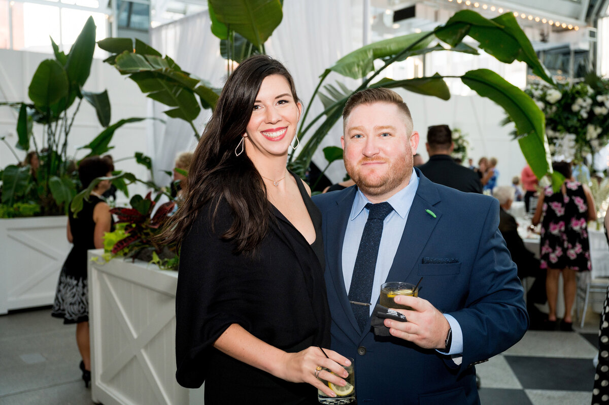 couple smiling for a photo during the cocktail hour
