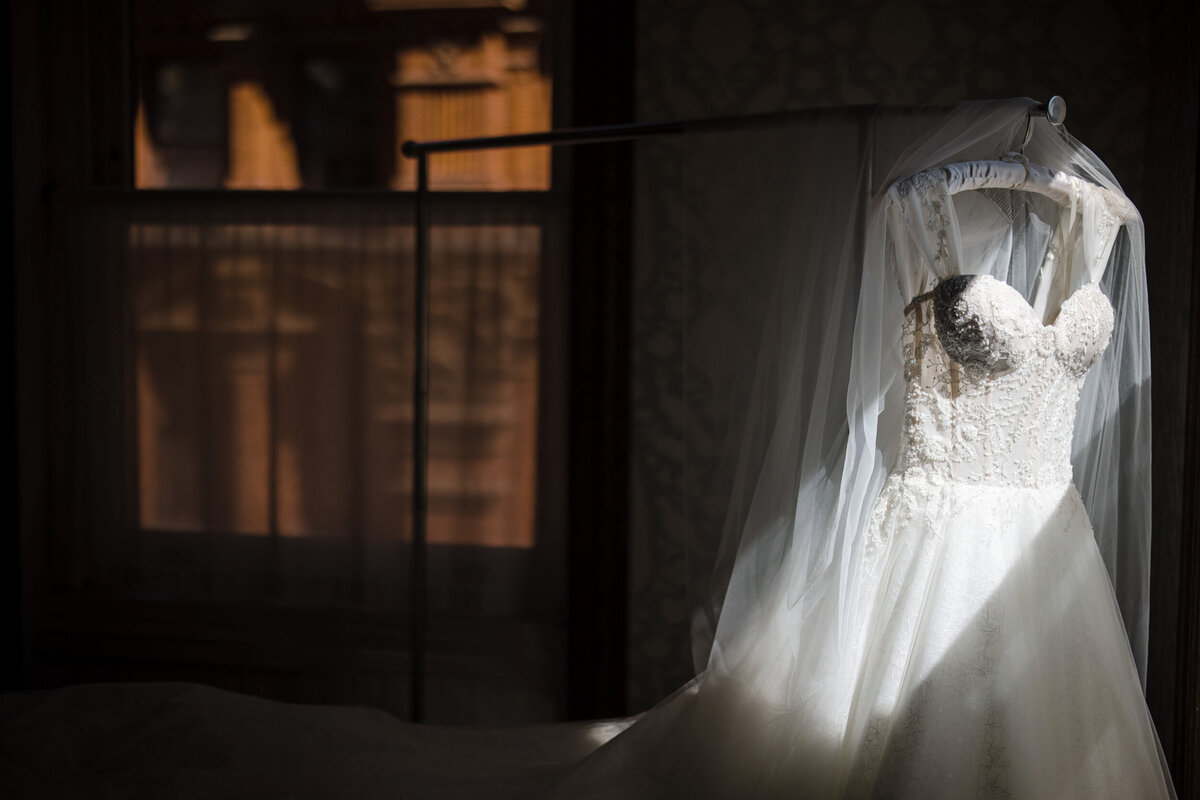 A wedding dress in the sunlight  at a Beekman Hotel wedding
