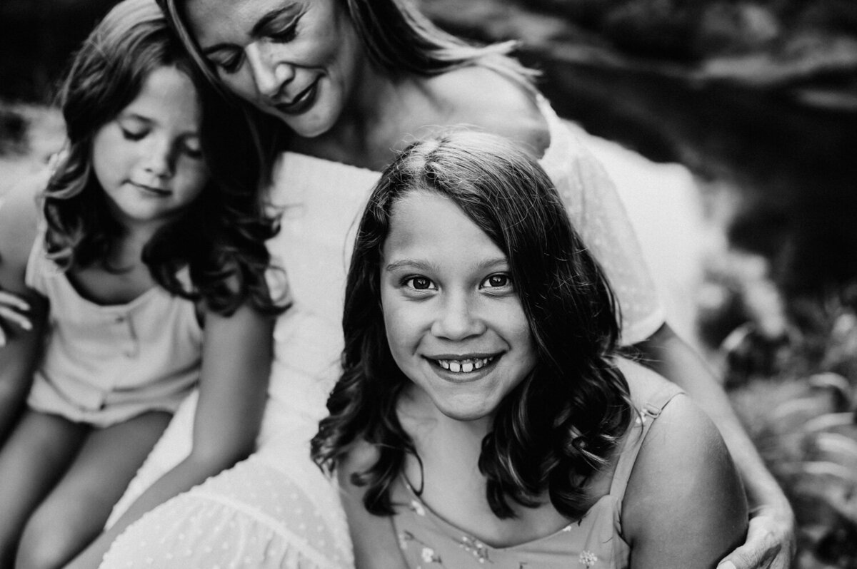 mother and daughters hugging