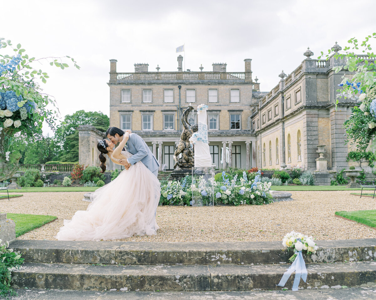 Bride and groom kissing outside Somerley House wedding venue