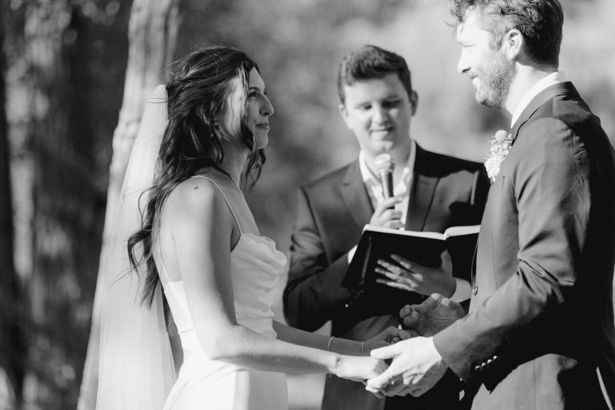 Bride and groom exchanging vows at Dallenbach Ranch Colorado Wedding