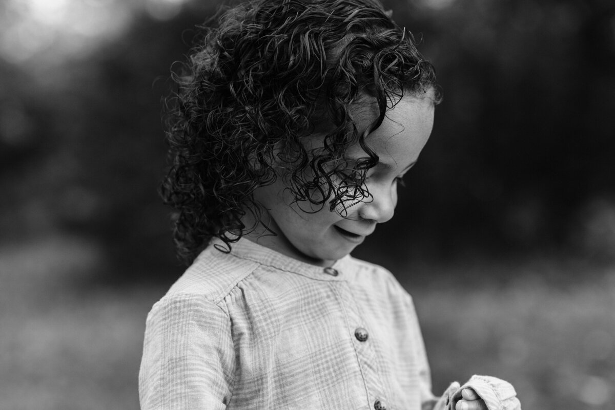 A gorgeous B&W of a toddler with curly hair, by Denise Van, a nothern Virginia family photographer