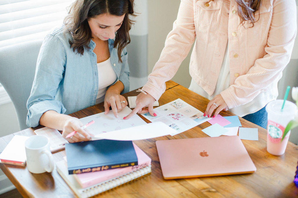 Two women working together