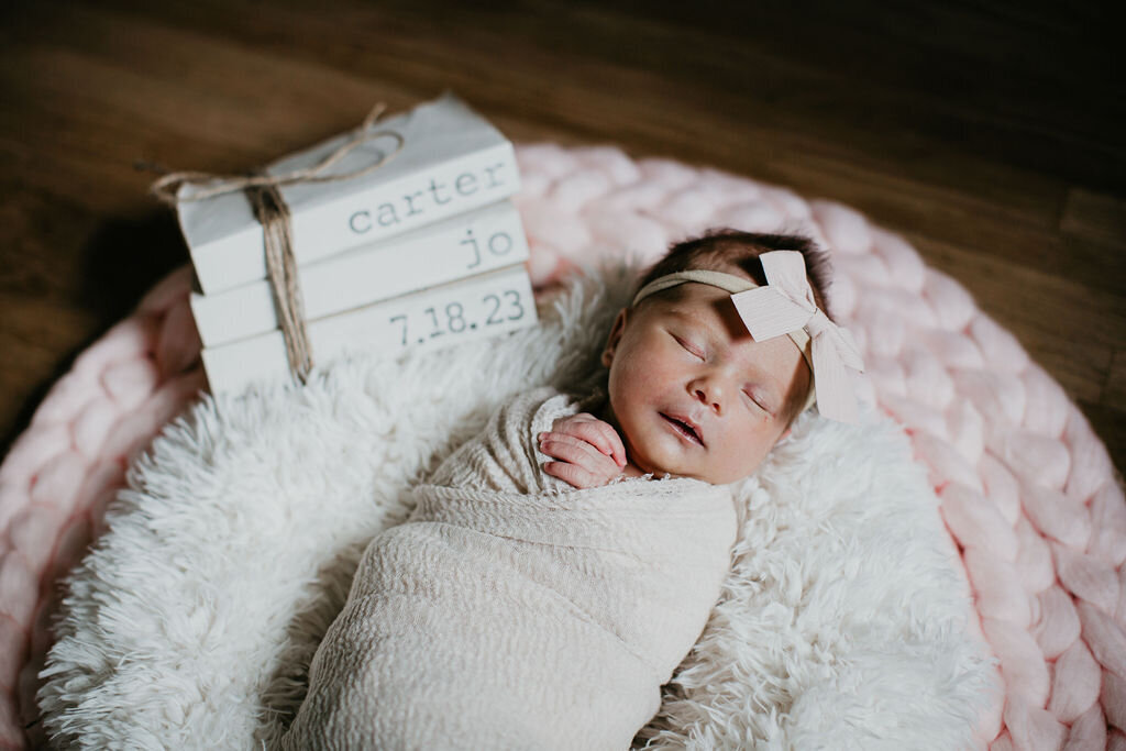 Newborn girl with a headband