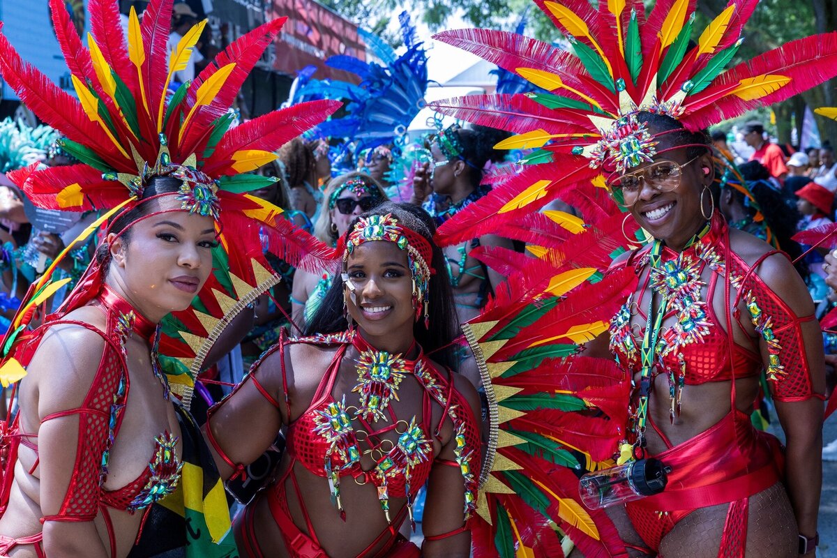 Toronto caribbean carnival parade masqueraders having fun in costume with Sunlime Mas, the number 1 medium size band at Toronto Carnival.