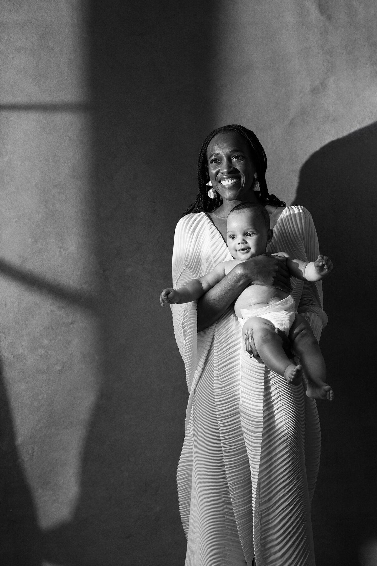 Bride poses with baby at the Nantucket Hotel.