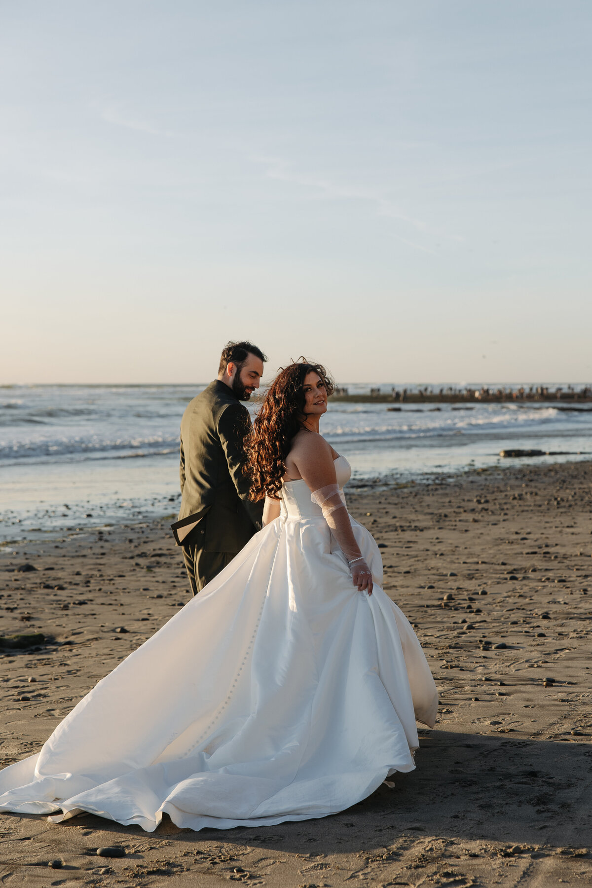 bride and groom on beach, bride and groom walking on beach,  carlsbad windmill venue, wedgewood weddings