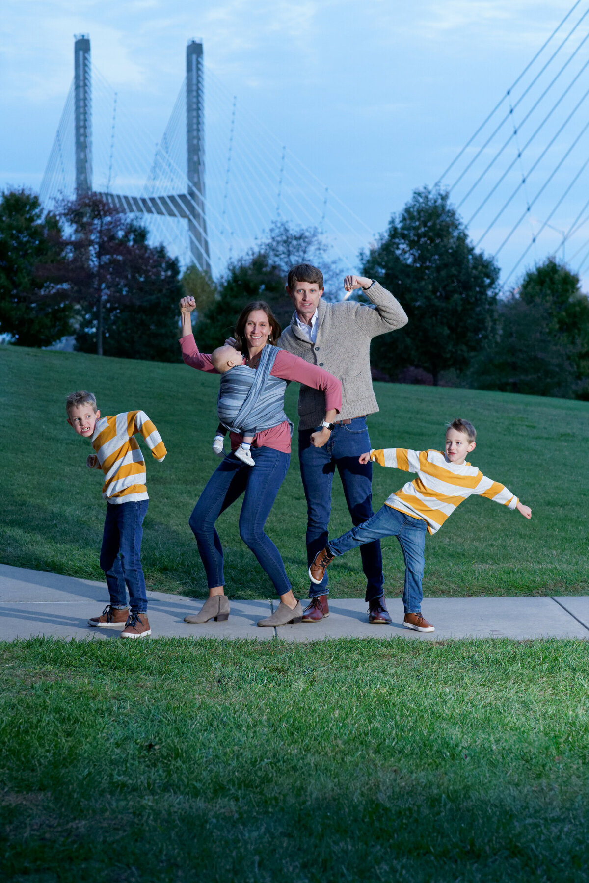 family being silly cape girardeau bridge outdoor nighttime portrait