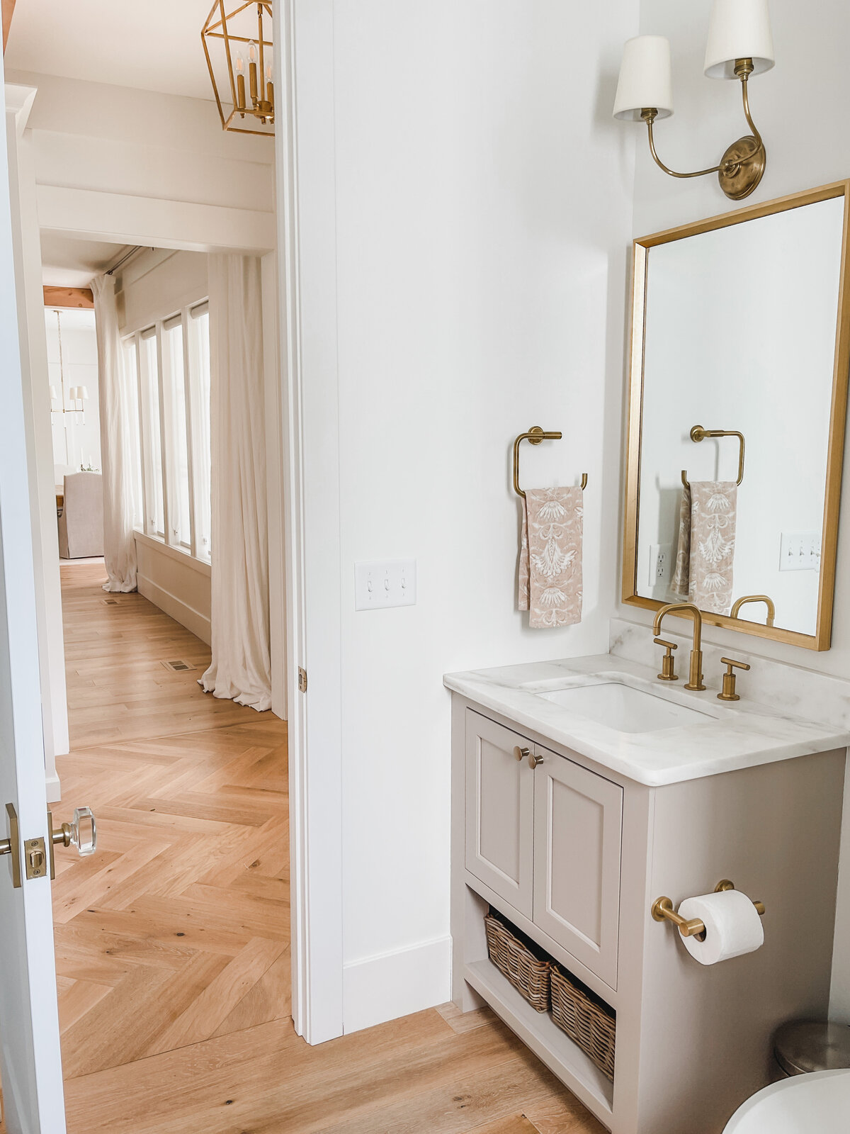 The first floor powder room is perfectly situated between the mudroom and back door