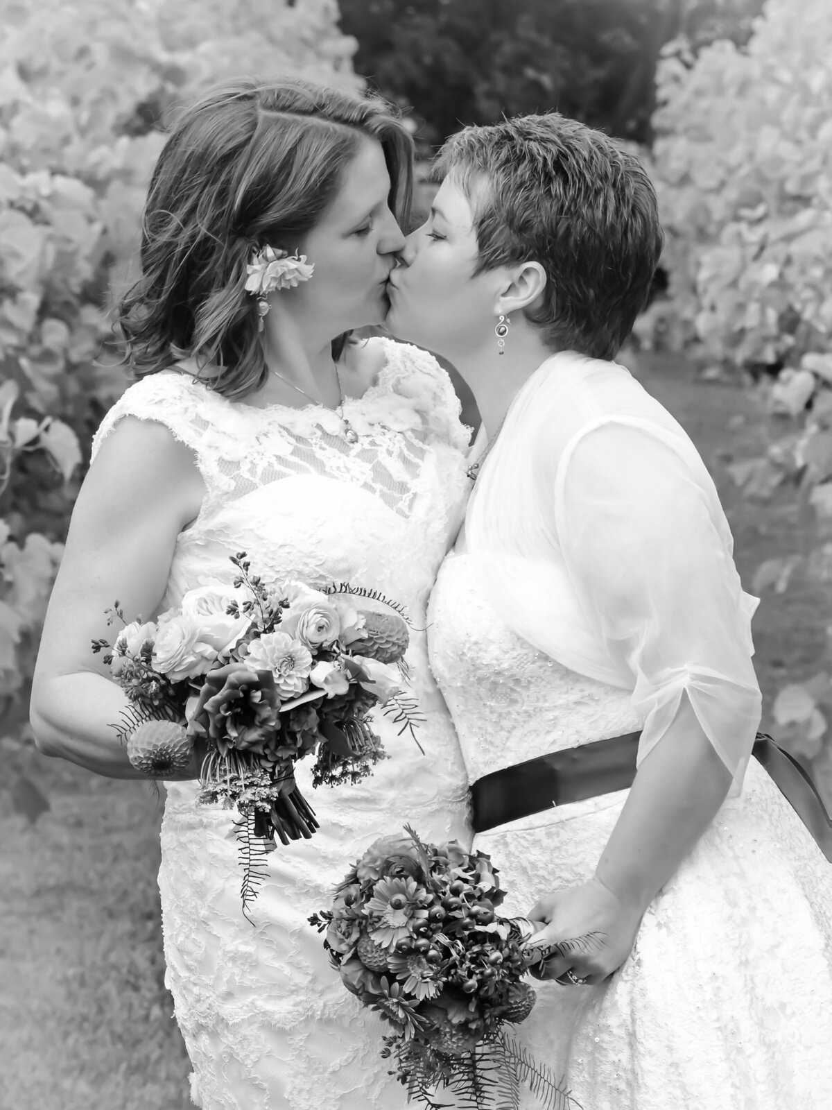 Black and white portrait of brides at same sex wedding in Southern Maine