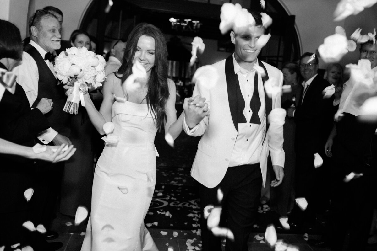 A bride and groom exit their wedding at the Cloister at Sea Island