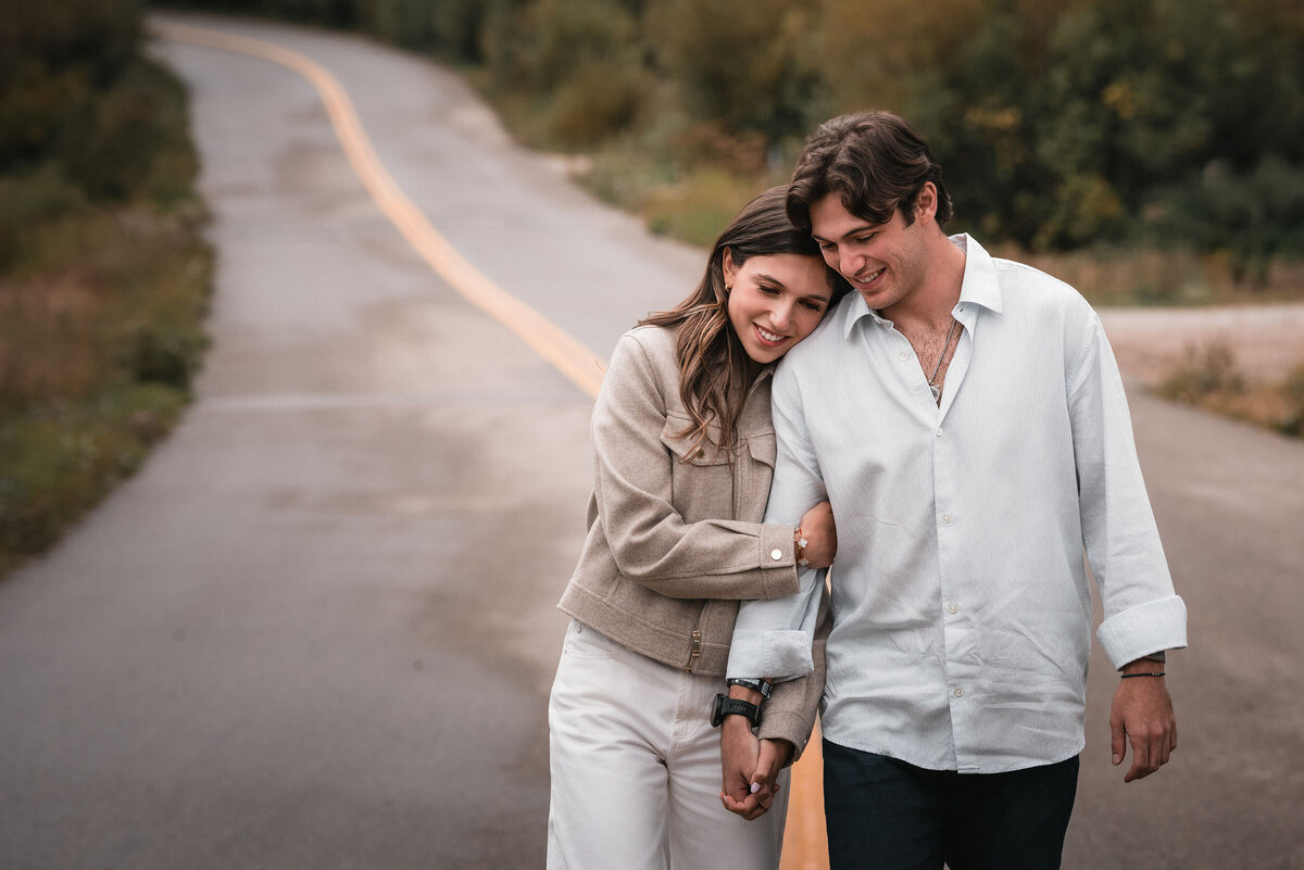 Engaged couple embracing in a mountain meadow near Aspen