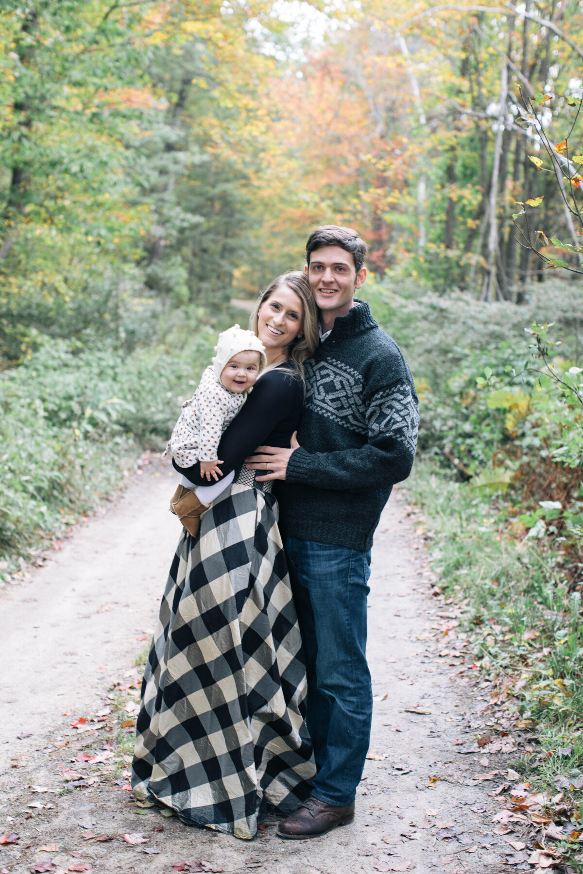 couple with baby at family session in new hampshire
