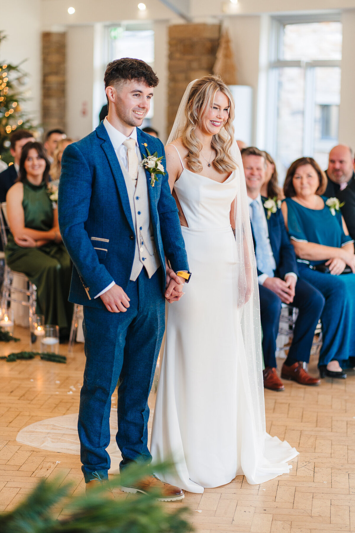 Bride and groom smiling during theor wedding ceremony at Mytton Fold Hotel Taken by candid wedding photographer Anthony Horseman