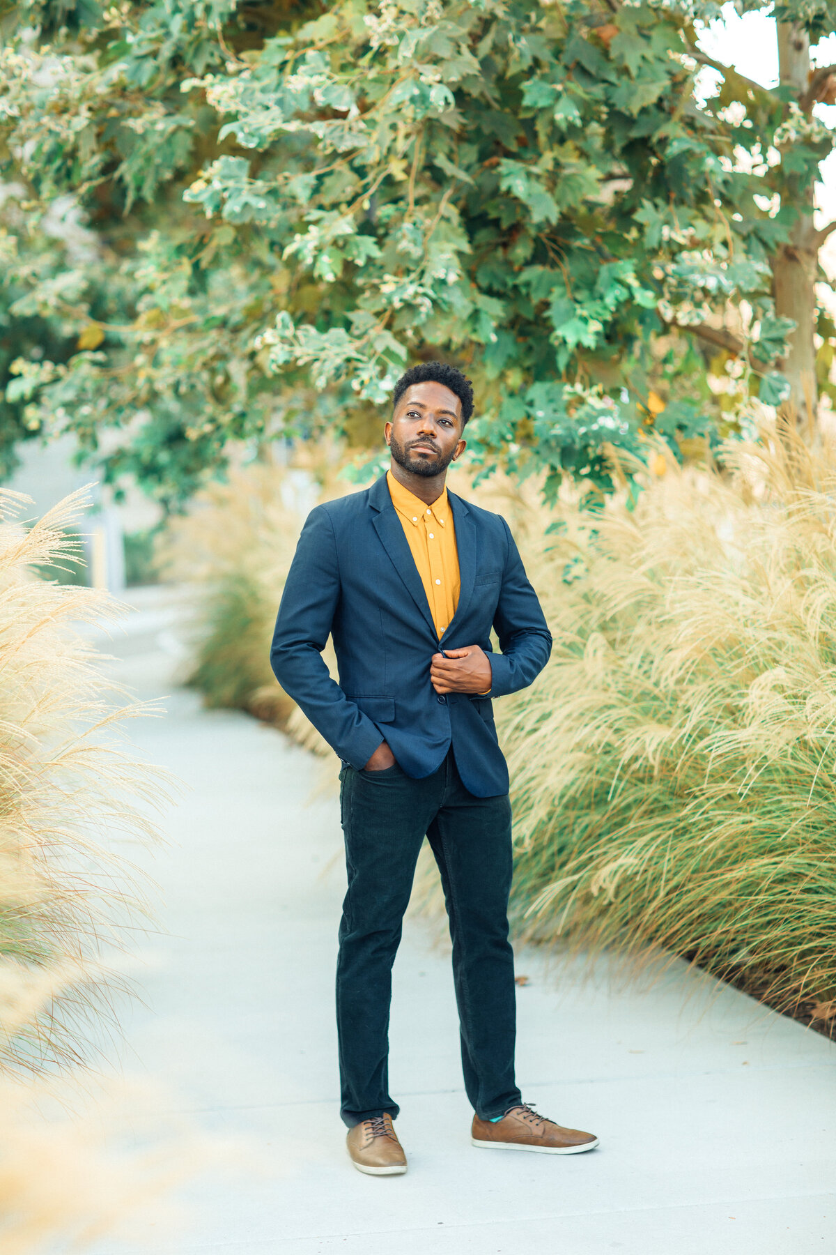 Portrait Photo Of Young Black Man In Blue Coat Los Angeles