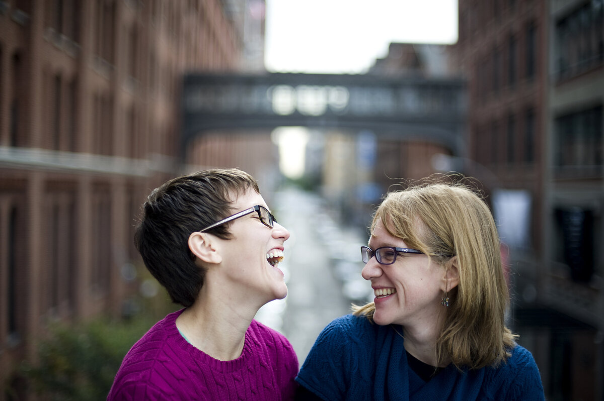 A couple sitting together and laughing 