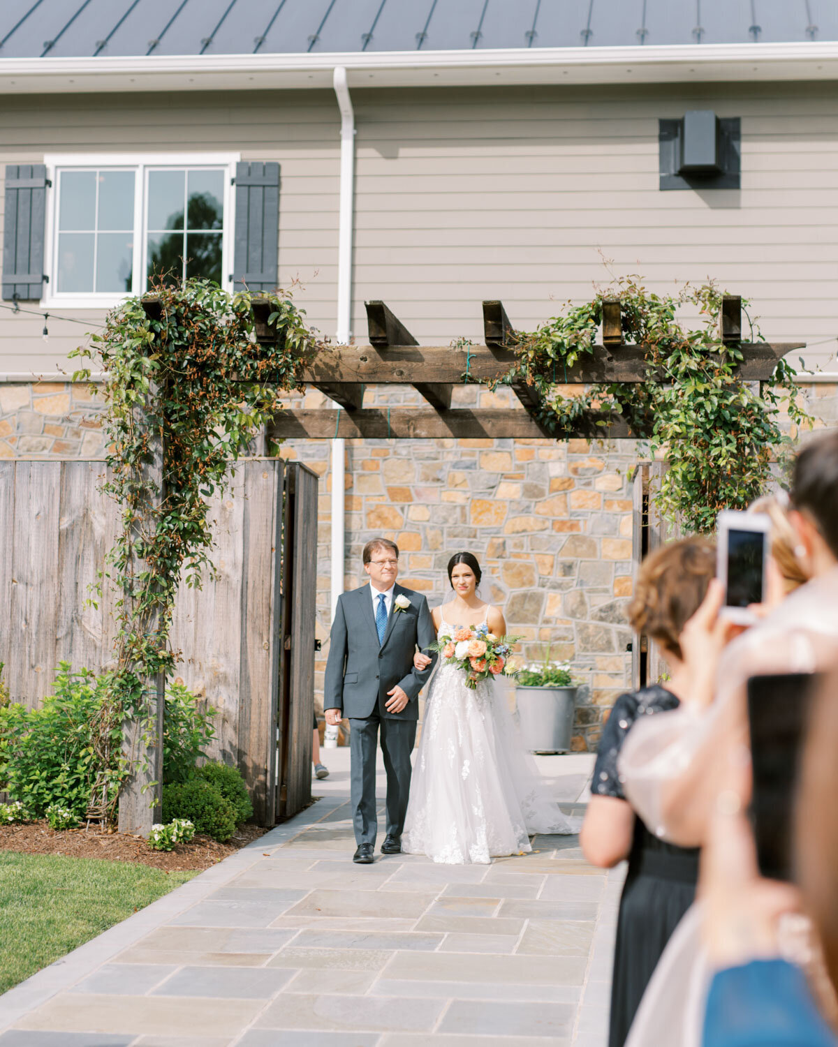 Father and bride walking down the aisle 
