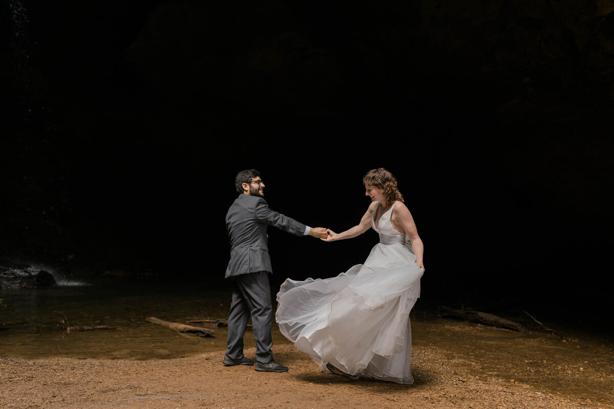 Married couple holding hands in Hocking Hills State Park, Ohio