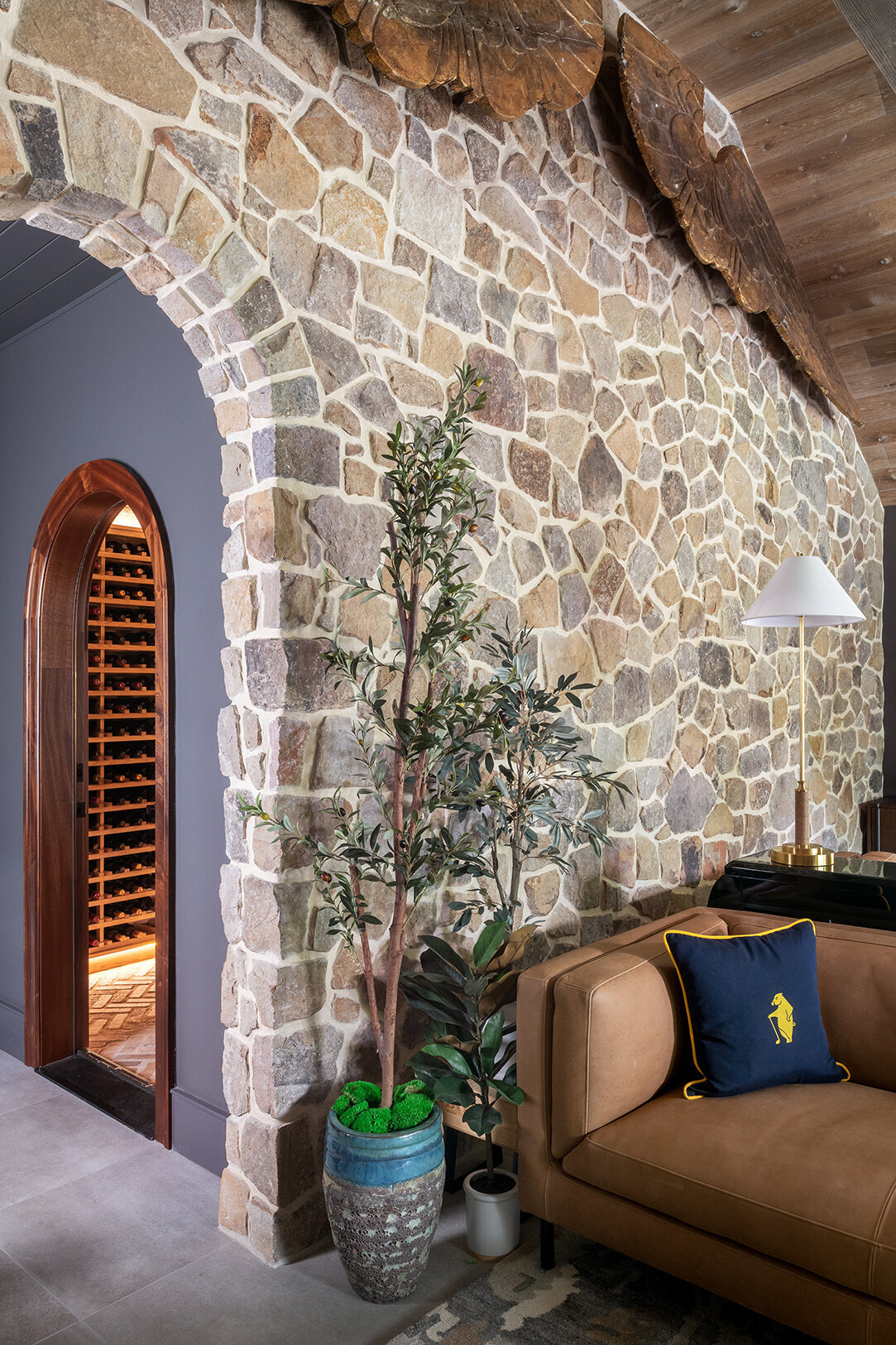 lounge room with arch cellar entrance 
