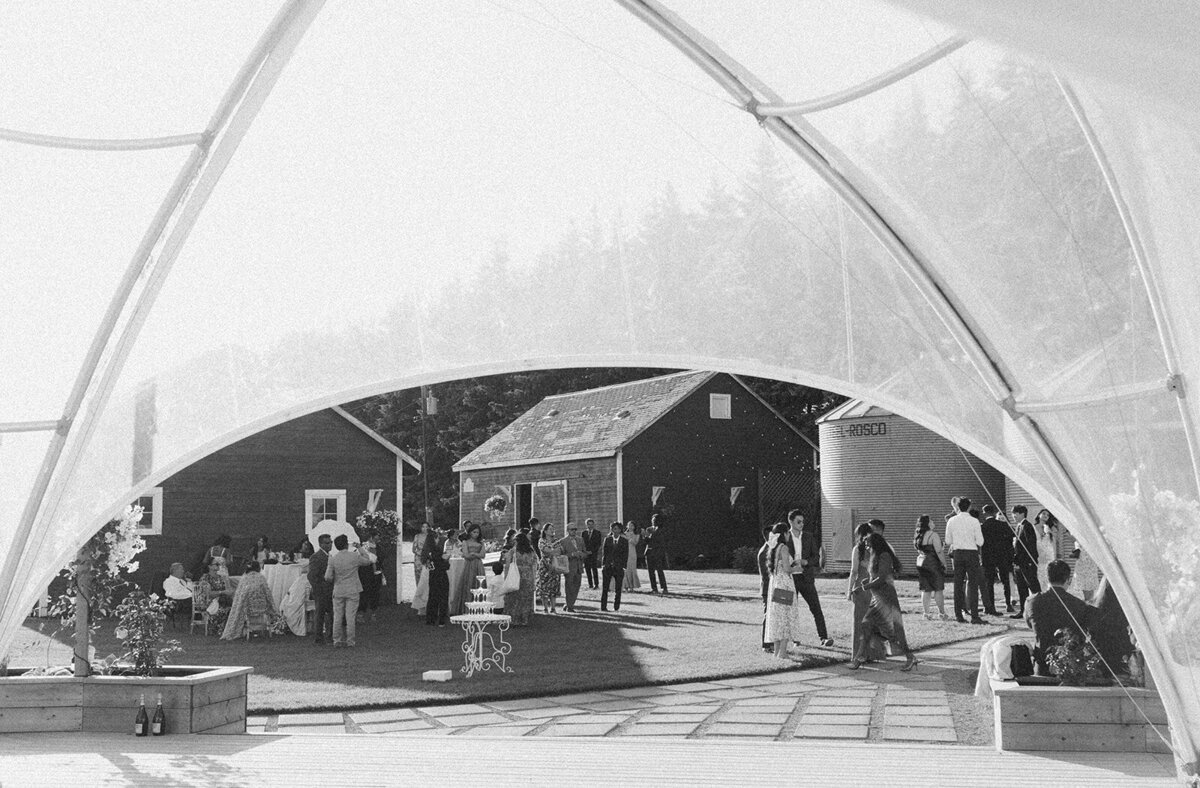 Summer tent wedding at River's Edge in Devon Alberta, find Alberta wedding venues  on the Brontë Bride Vendor Guide